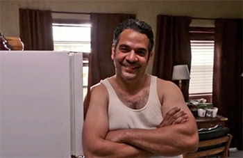 Photo of Hemky Madera playing Burn Notice TV character Eddie