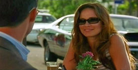 Photo of Moon bloodgood playing Burn Notice TV character Detective Paxson